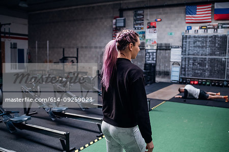 Young couple working out in gym