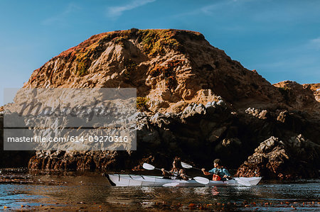 Friends kayaking in sea, Big Sur, California, United States