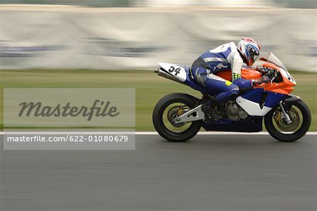 Racing motor bike on track