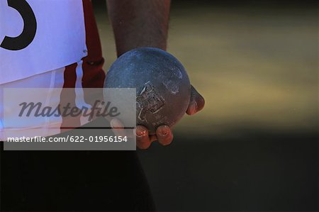 Athlete Holding Metal Ball