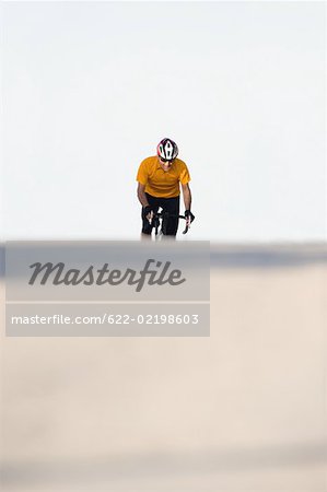 A man cycling on road