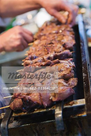 Kebab being cooked on grill