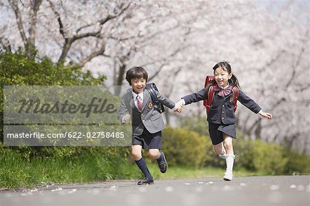 Schoolmate running on road