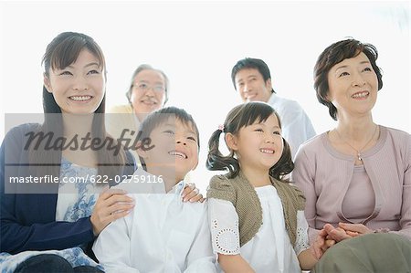 Asian family sitting together