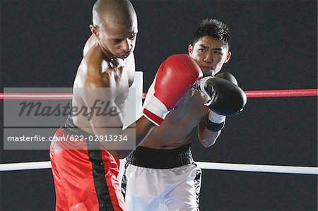 Japanese boxer hitting his opponent