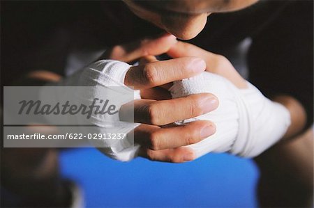 Boxer's hands and knuckles tied with bandage