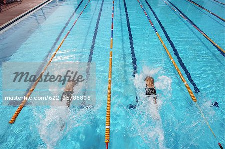 Swimmers Competing in Pool