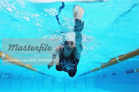 Woman Swimming in Pool, Underwater