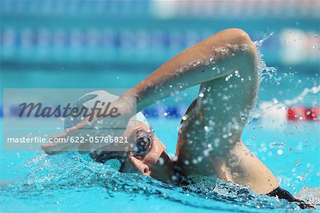 Woman Swimming in Pool, Underwater