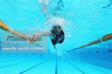 Woman Swimming in Pool, Underwater Woman Swimming in Pool, Underwater