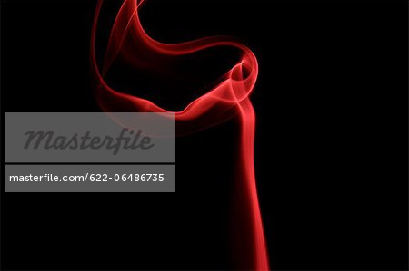 Red smoke on black background