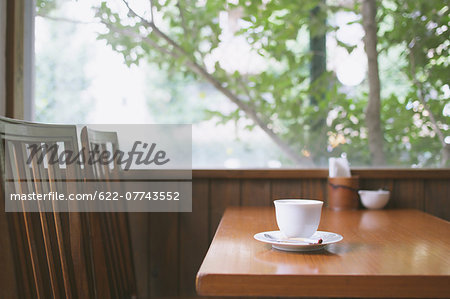 Coffee on wooden table in a cafe