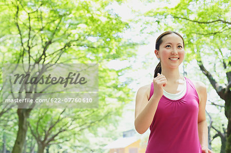 Young Japanese girl walking in the park