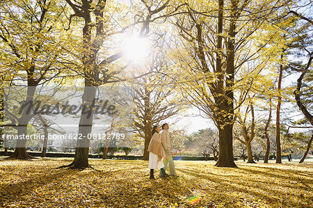 Senior Japanese couple in a city park in Autumn