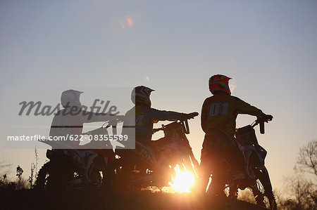 Motocross bikers on dirt track