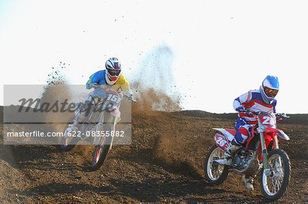 Motocross bikers on dirt track