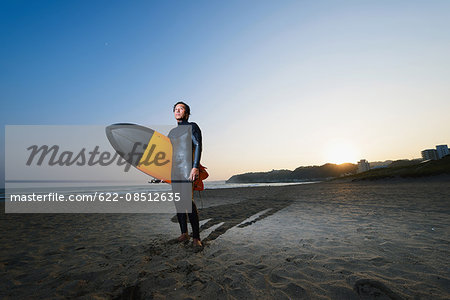 Japanese surfer portrait on the beach