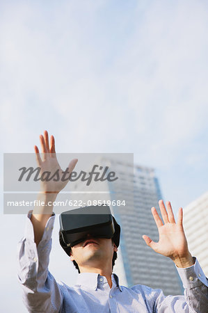 Japanese man using virtual reality device