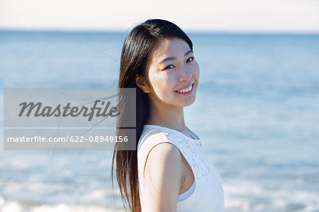 Lonly Young Woman By The Sea Stock Photo - Download Image Now - Women,  Japanese Ethnicity, Teenage Girls - iStock