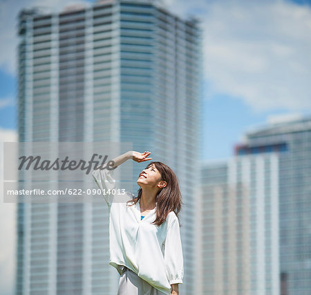 Portrait of young Japanese woman downtown Tokyo, Japan Portrait of young Japanese woman downtown Tokyo, Japan