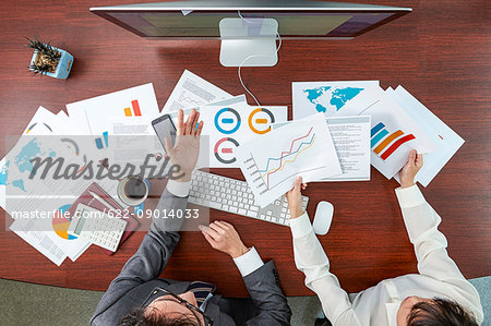 Top view of Japanese businesspeople talking in meeting room