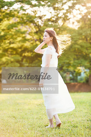 Attractive Japanese woman in a city park