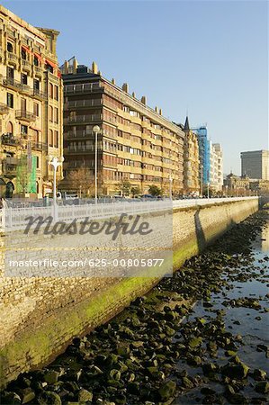 Low angle view of buildings on a waterfront, Spain