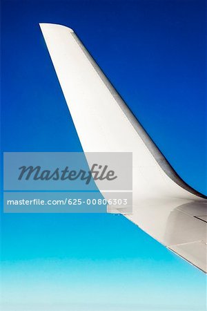 Close-up of an airplane wing in flight