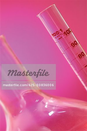 Close-up of a pipette and a beaker