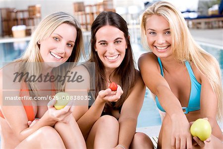 Three Young Women by the Swimming Pool Stock Photo - Image of