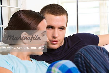 Portrait of a young man and a young woman smiling