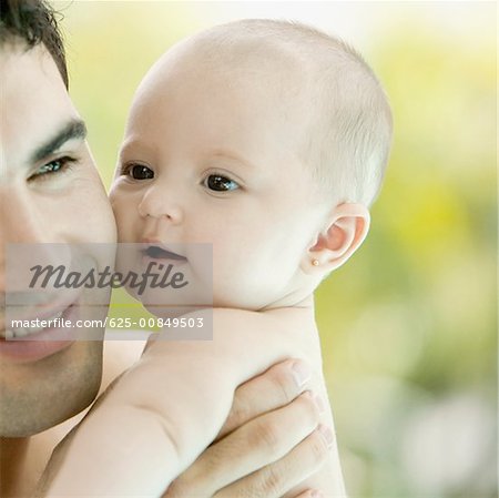 Close-up of a father with his baby girl
