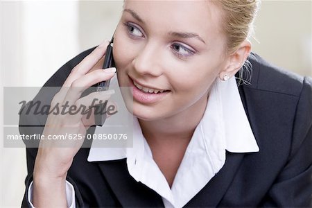 Close-up of a businesswoman talking on a mobile phone