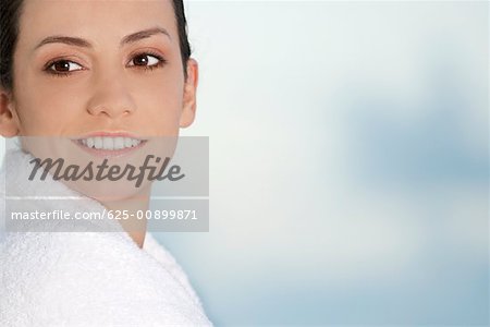 Close-up of a young woman wrapped in a towel