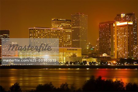 Buildings in a city lit up at night, New Orleans, Louisiana, USA