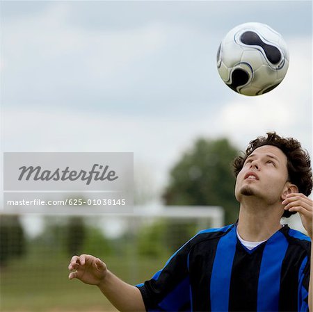 Close Up Of A Soccer Player Heading A Soccer Ball Stock Photo Masterfile Premium Royalty Free Code 625