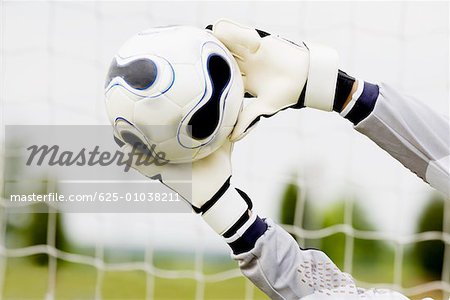 Close-up of a goalie's hands making a save