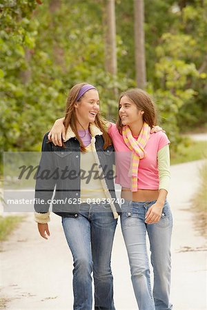 Two Girls With Their Arms Around Each Other Stock Photo Masterfile Premium Royalty Free Code 625