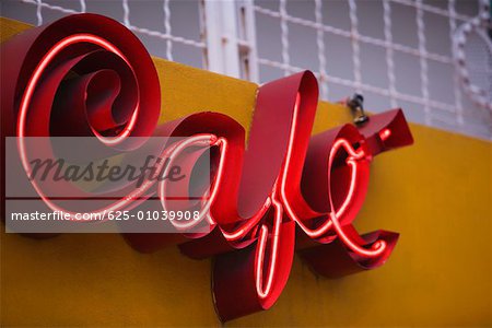 Low angle view of a store sign on a building wall