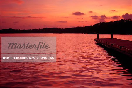 Silhouette of a pier in the sea