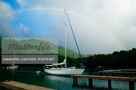 Rainbow is seen over a harbor, St. Lucia, Caribbean