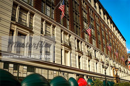 Low angle view of American flags on a building, Manhattan, New York City, New York State, USA