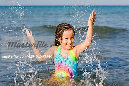 Close-up of a girl playing in the sea