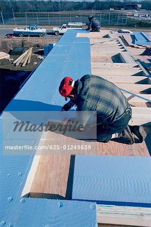 Putting insulation into solar- powered home, Maryland
