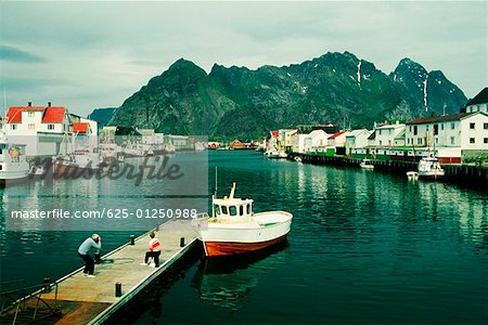 High angle view of two people on a pier, Lofoten Islands, Norway