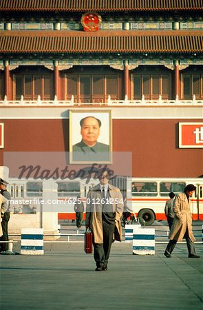 Businessman walking in front of a palace, Tiananmen Gate Of Heavenly Peace, Tiananmen Square, Beijing, China