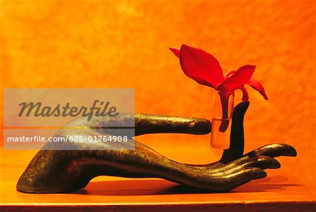 Close-up of a sculpture of a human hand holding massage oil, Koh Samui, Thailand