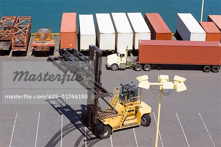 High angle view of cargo containers and a crane at a commercial dock