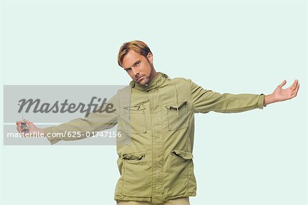 Portrait Of A Mid Adult Man Posing With His Arms Outstretched Stock Photo Masterfile Premium Royalty Free Code 625