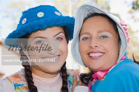 Portrait of a young woman and a mid adult woman smiling